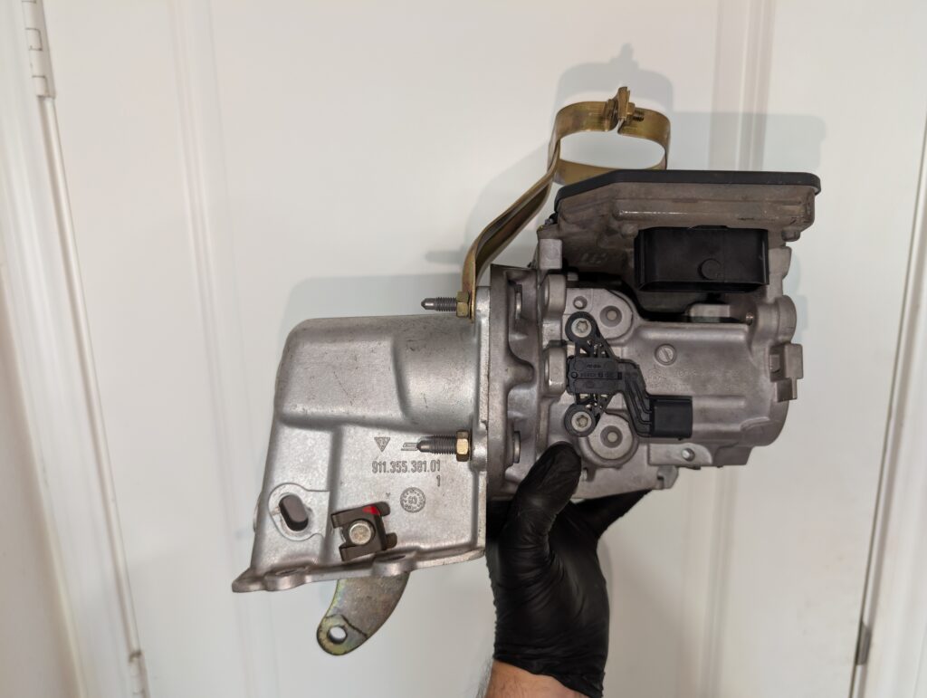 Bosch iBooster mounted to a Porsche 911 Carrera 3.2 brake booster bracket